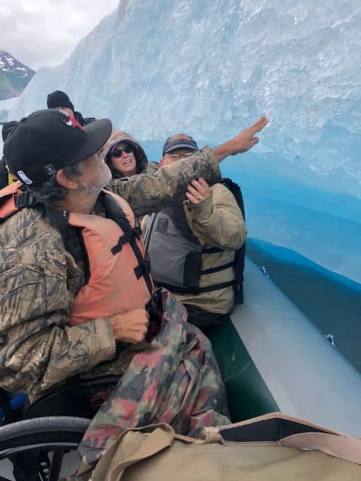 Gentleman touching an Iceberg on a raft