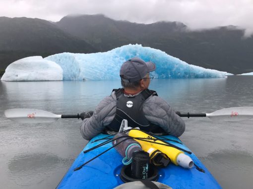 Tandem Kayak Grandpa at 89 front seat looking at an Iceberg